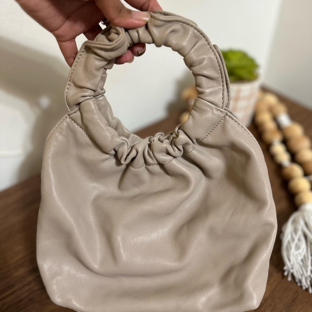 Tan hand bag